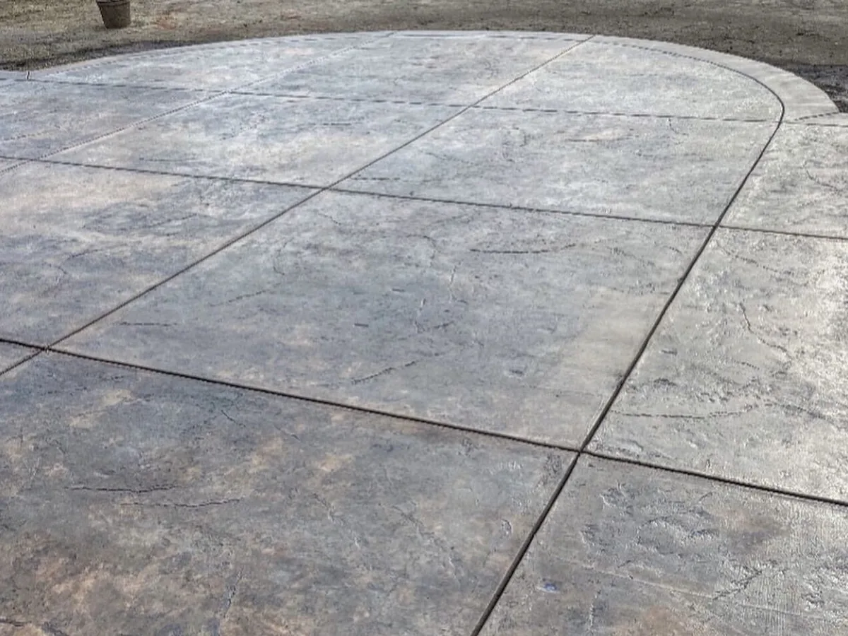 Close view of ashlar-pattern stamped concrete with hand-tooled joints